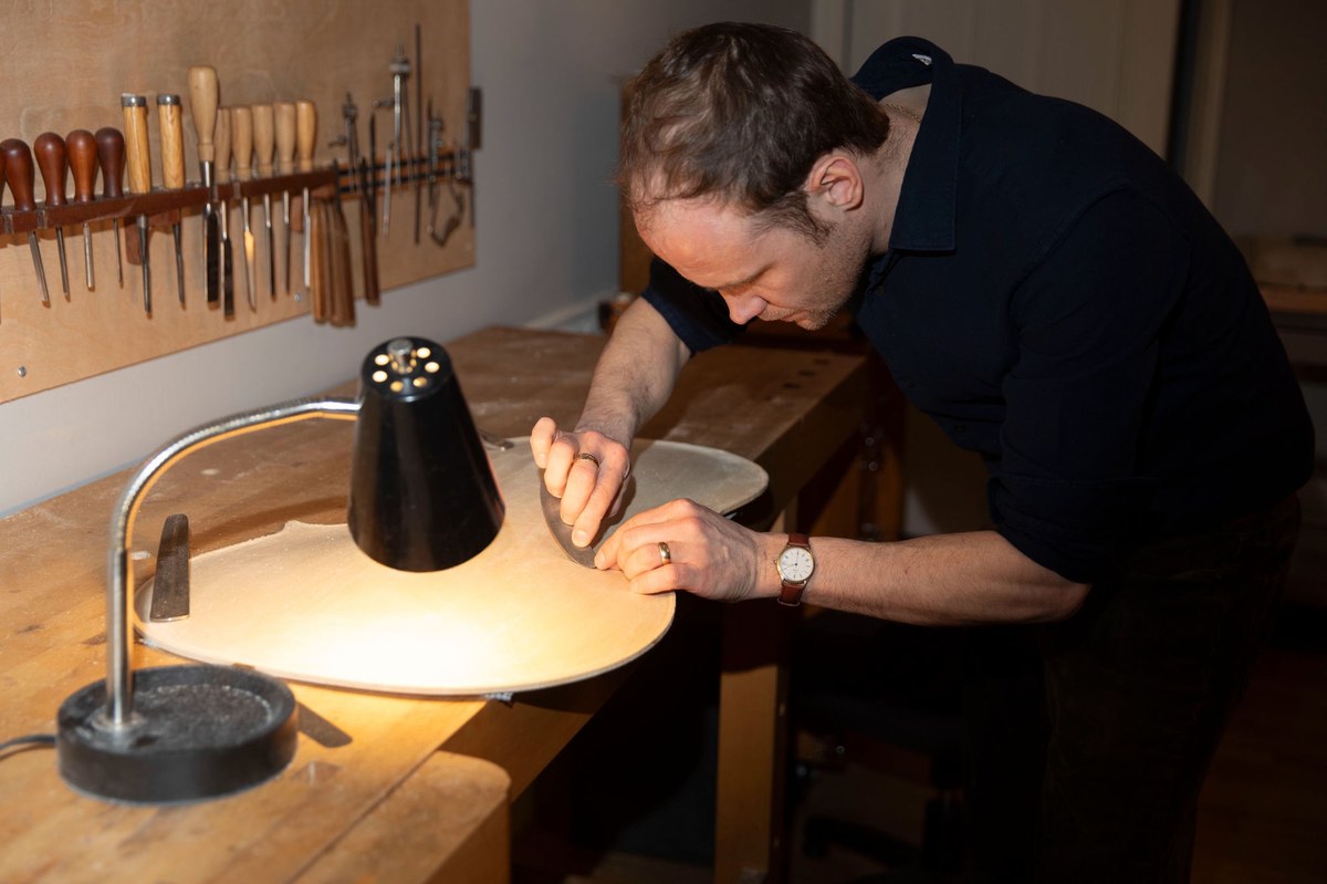 Ryan Fini carving a violin top